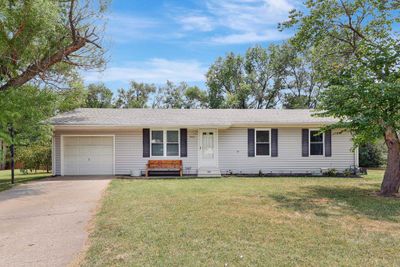 Single story home with a garage and a front yard | Image 1