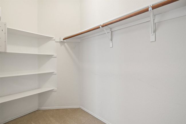 Walk in closet with carpet | Image 28