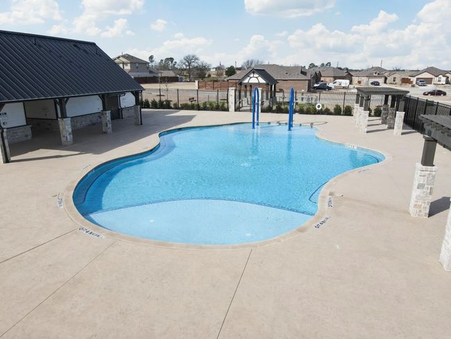 Community pool with a patio area and a residential view | Image 37