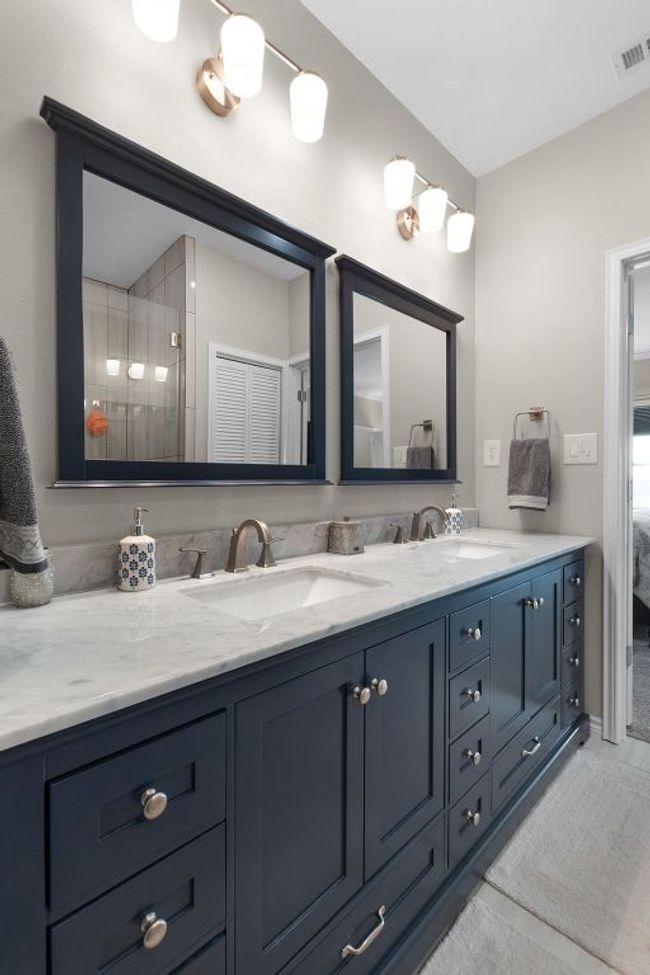 Primary Bathroom with double vanity, visible vents, and a sink | Image 15