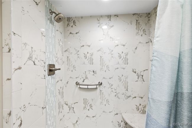 Bathroom featuring tiled shower | Image 16