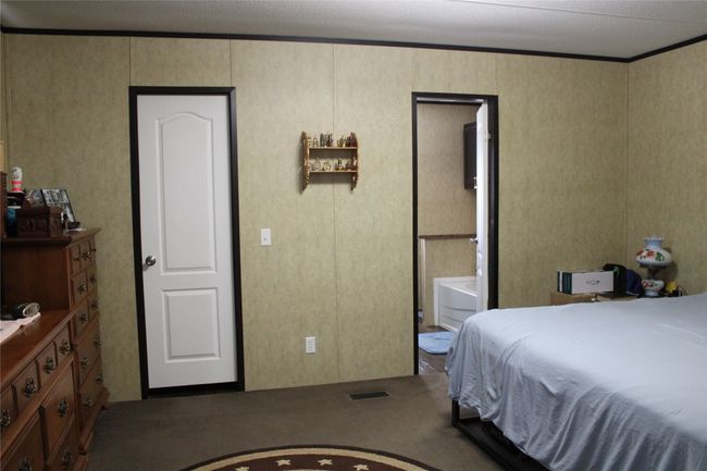 Bedroom with a decorative wall | Image 23