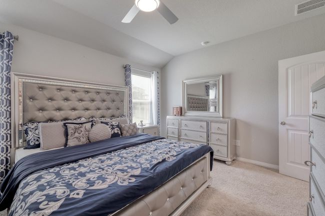 Bedroom featuring light colored carpet, and ceiling fan | Image 16