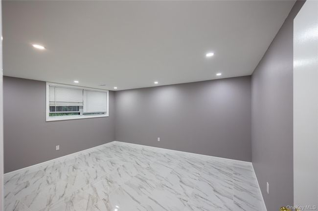 Spare room with recessed lighting and marble look tile flooring | Image 6