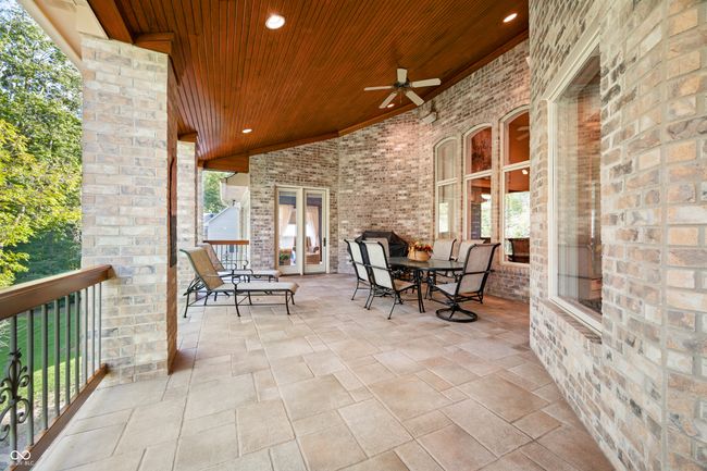 view of patio featuring a ceiling fan | Image 58
