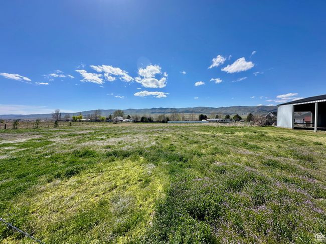View of yard featuring a mountain view and a rural view | Image 9