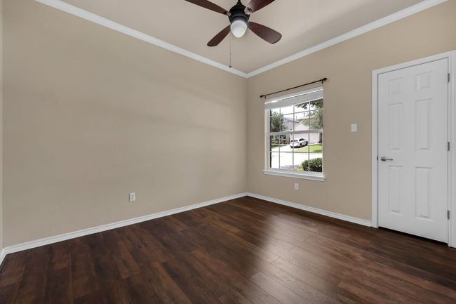 Three additional bedrooms offer flexibility for family, guests, or home office needs—the fourth bedroom is ideal as a study or workspace. | Image 21