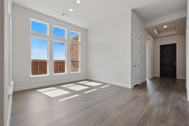Unfurnished room featuring recessed lighting, visible vents, baseboards, and wood finished floors | Image 11