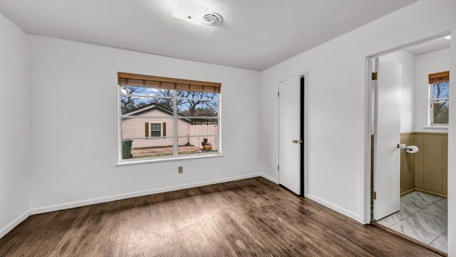 Primary bedroom featuring ensuite bath and walk in closet | Image 17