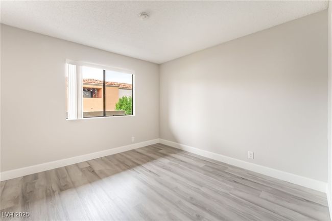 Spare room with light wood-style flooring and a smoke detector | Image 22