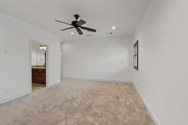 Spare room featuring ceiling fan, light colored carpet, and recessed lighting | Image 30