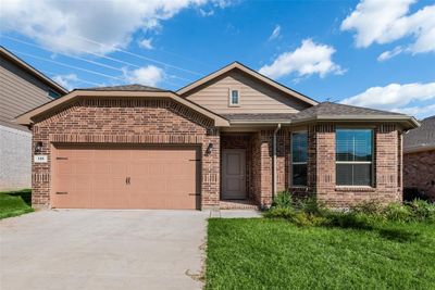 View of front of house featuring a garage and a front yard | Image 3