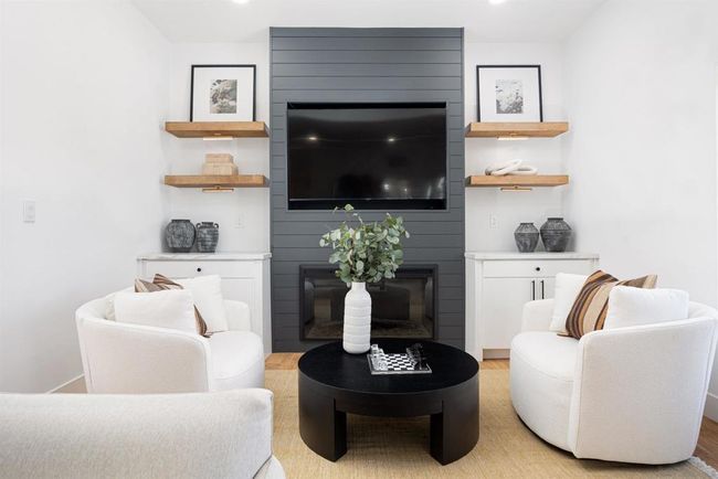 Large living room and entry area, custom fireplace with built in cabinets and floating shelves | Image 20