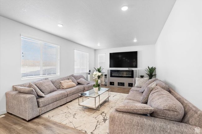 Living area featuring wood finished floors and recessed lighting | Image 4