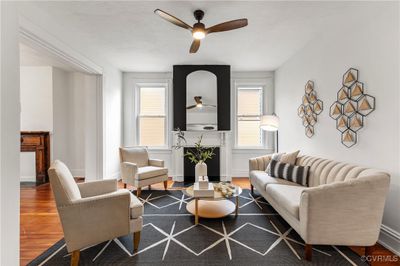 Living room with ceiling fan and hardwood / wood-style flooring | Image 1