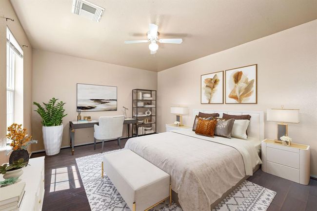 Spacious secondary bedroom featuring plenty of natural light, ceiling fan, and easy-to-clean tile flooring. *Virtually Staged | Image 15