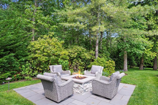View of patio featuring a fire pit | Image 27