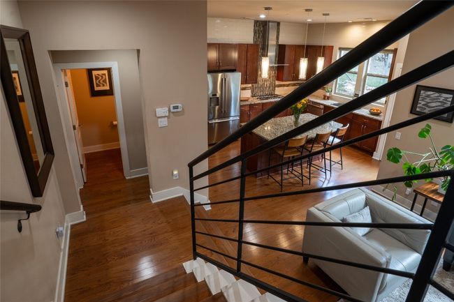 Stairs with wood-type flooring and baseboards | Image 13