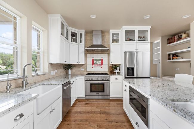 Modern fixtures and farmhouse-inspired details make this kitchen both functional and beautiful. | Image 13