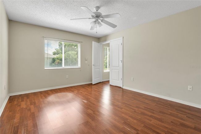 Primary Bedroom looking towards French doors and Living room. | Image 7