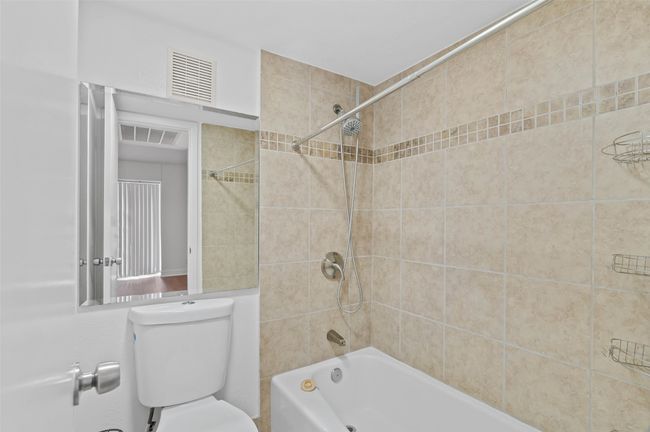 Downstairs ensuite bathroom with custom tile shower/bath. | Image 12
