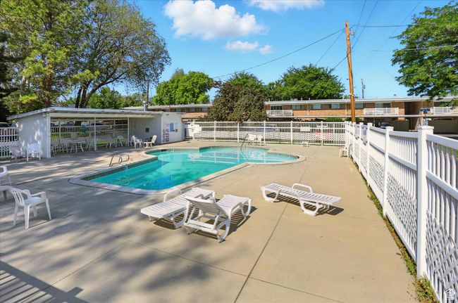 Community pool with a patio area | Image 27