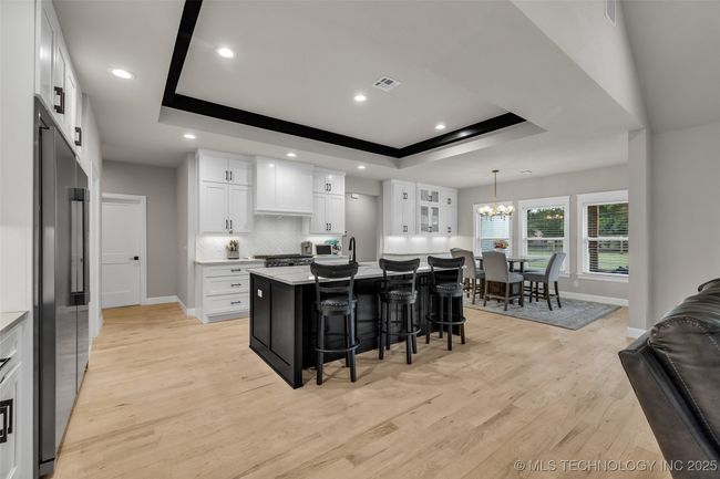 Kitchen with dining over- looking backyard | Image 7