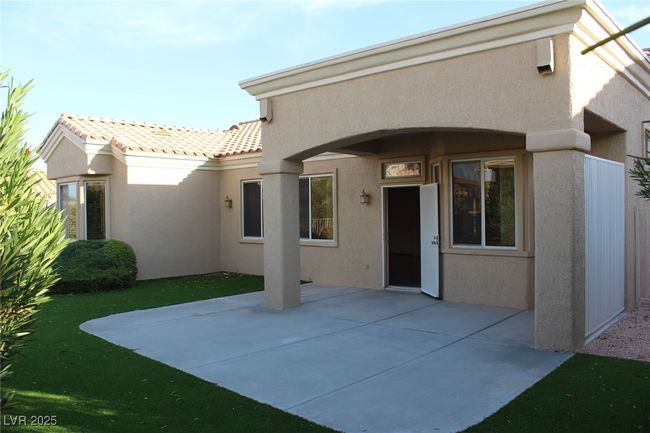 Rear view of property with a patio area, a tile roof, stucco siding, and a lawn | Image 16