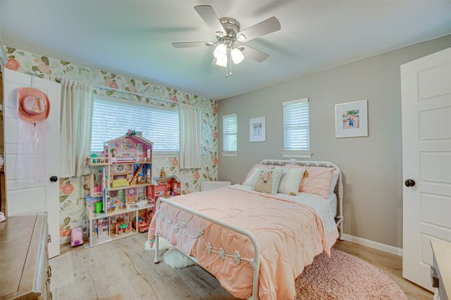 Bedroom featuring light wood-style floors and ceiling fan | Image 20