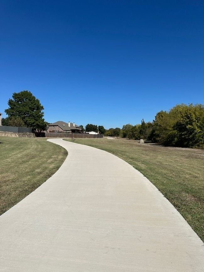 View of community featuring a lawn | Image 14