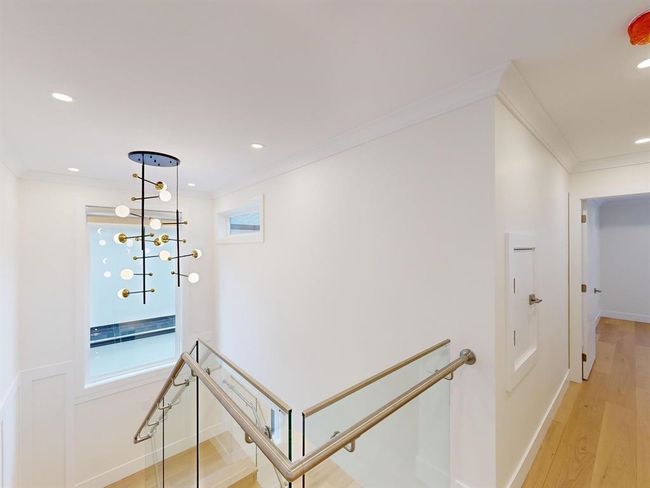 Hall with an upstairs landing, ornamental molding, light wood-style floors, and recessed lighting | Image 25