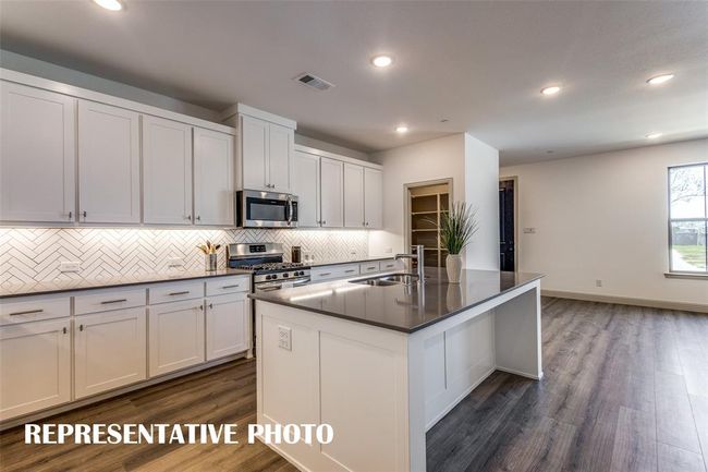 With ample storage and prep space, this kitchen offers everything you have been searching for in a dream kitchen! REPRESENTATIVE PHOTO. | Image 7