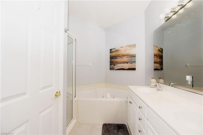 Unwind after a long day in the spa-like bathroom with soaking tub. | Image 14