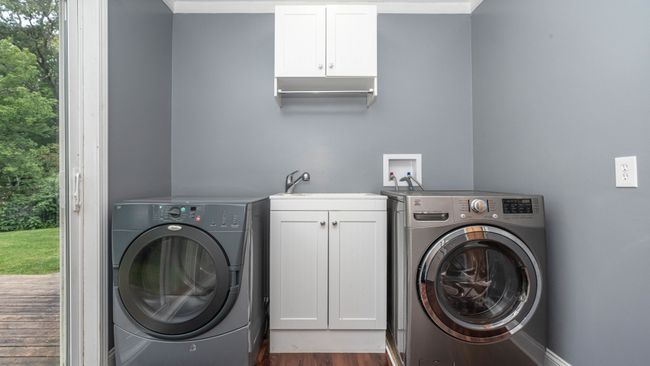 Main floor laundry off the kitchen w door | Image 31