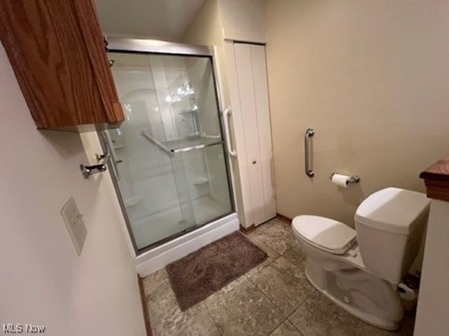 Bathroom with a shower stall and vanity | Image 15