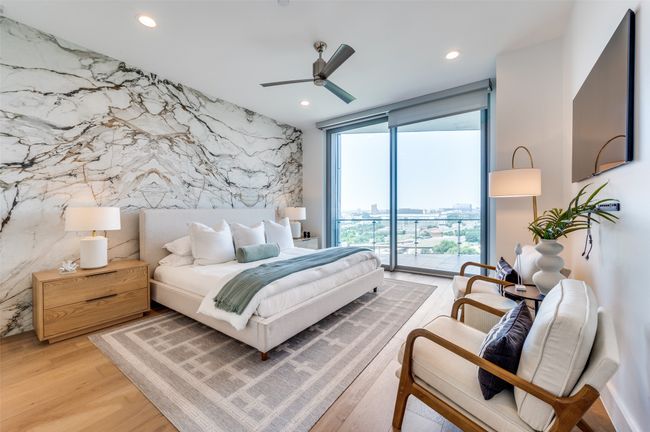Bedroom featuring access to exterior, floor to ceiling windows, recessed lighting, light wood finished floors, and a ceiling fan | Image 11