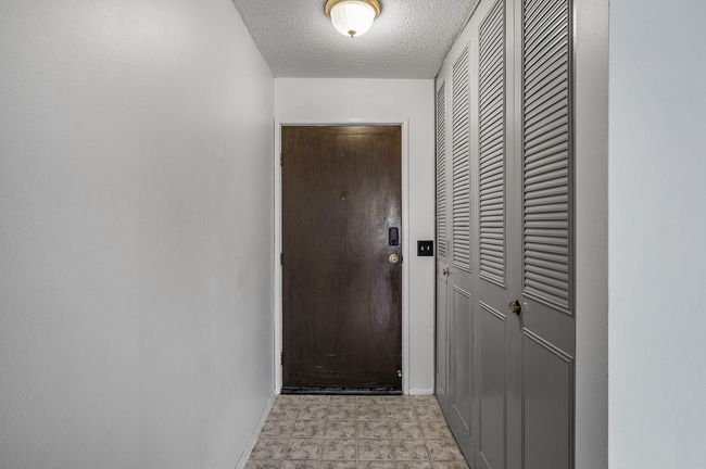 The entryway includes convenient storage for coats, shoes, and everyday essentials. | Image 4