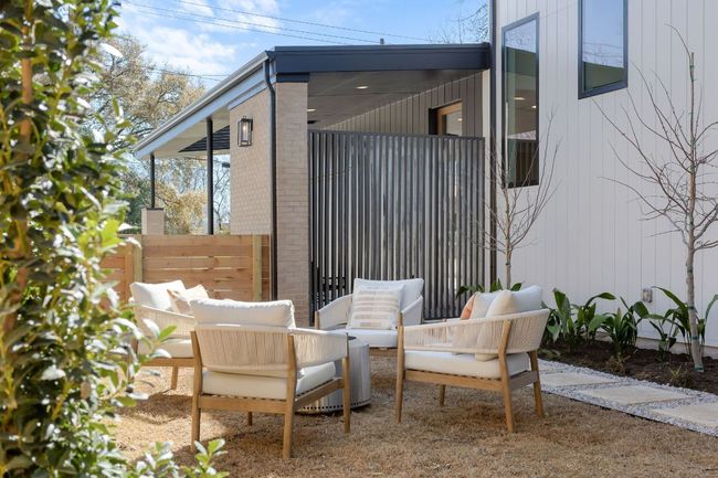 View of patio with an outdoor living space and fence | Image 7
