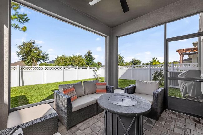 Screened in lanai with large backyard fully fenced in. | Image 30