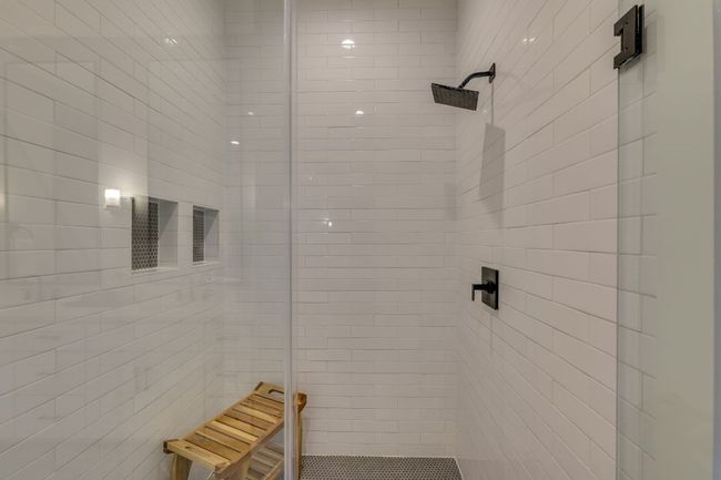 It also features an oversized walk in shower and access to the massive closet, complete with washer and dryer. | Image 25