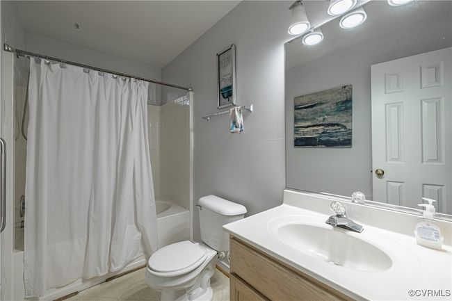 Full bathroom with vanity and shower / bath combination with curtain | Image 16