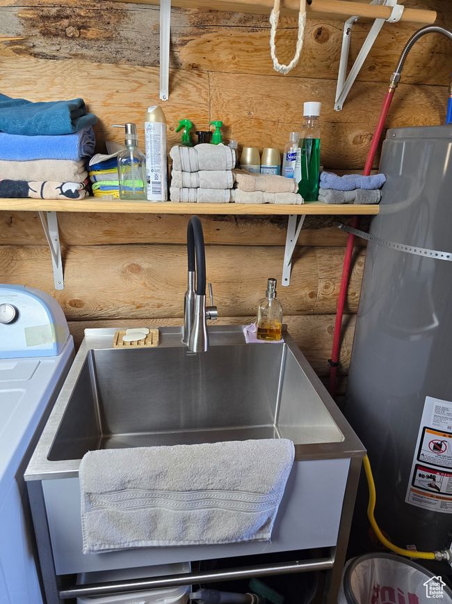 Room details featuring a sink, log walls, and washer / dryer | Image 115