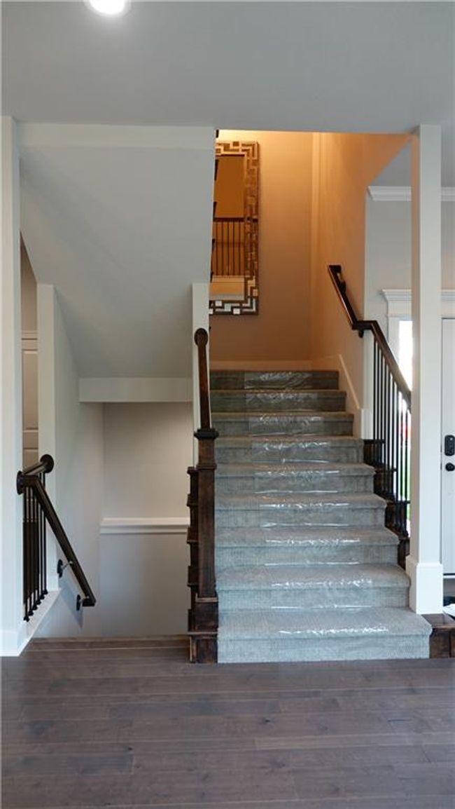 Staircase with wood finished floors | Image 24