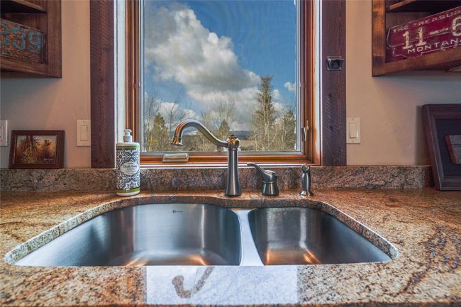Caretaker Quarters / Guest House. Interior details featuring stone counters and a sink | Image 70