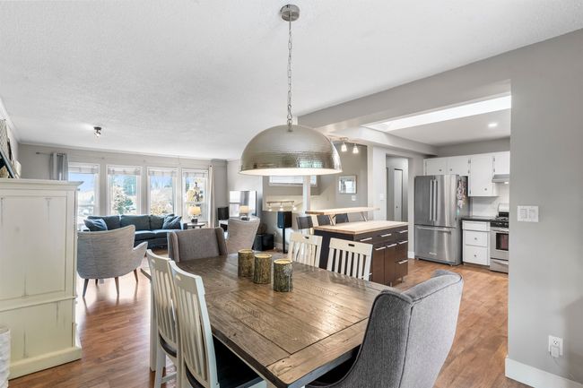 Dining room with light wood-style floors | Image 13