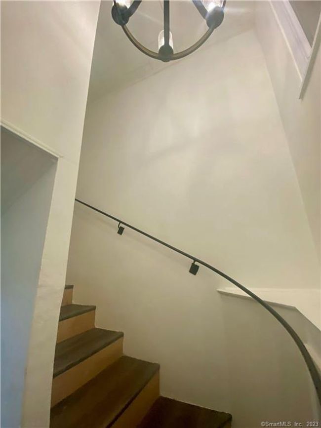 Spiral Staircase leading to finished lower level. | Image 23
