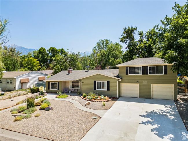 View of front of house with concrete driveway and a garage | Image 4
