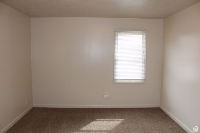 Spare room with carpet floors and healthy amount of natural light | Image 9