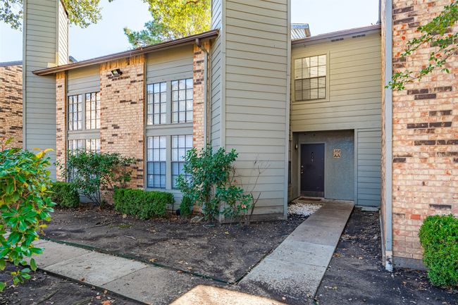 View of exterior entry with a chimney | Image 17