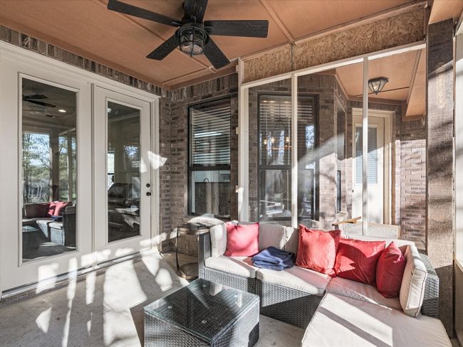 Screened in patio in the back. | Image 24